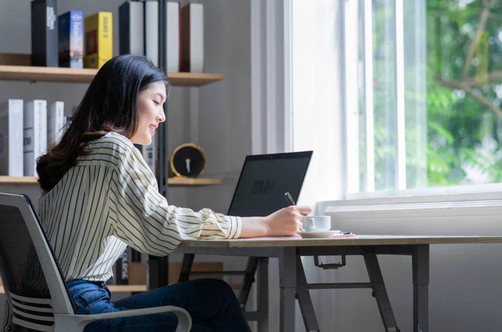 Image of a girl in front of her laptop 